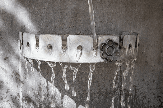 A water feature with a pump, ensuring proper pump function for a clean and clear water feature