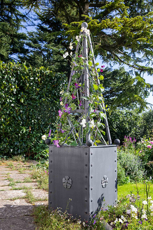 Plants growing on an Arthur Jack Steel Obelisk